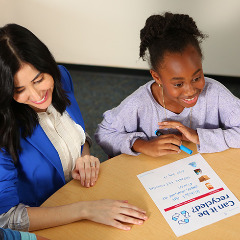 Student filling out handout
