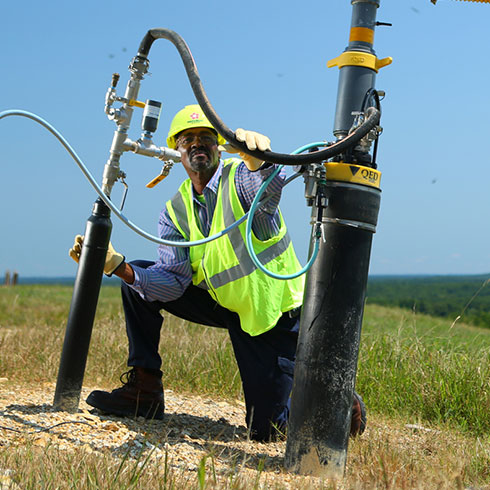 Worker checking gas line