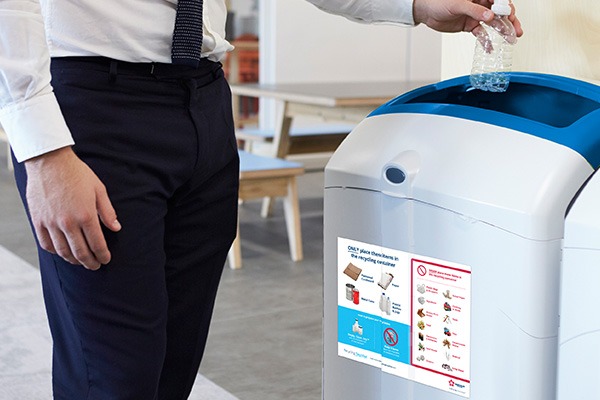 Office worker recycling.