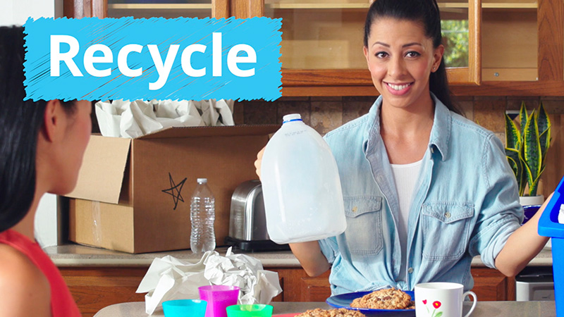 Person showing recycling examples